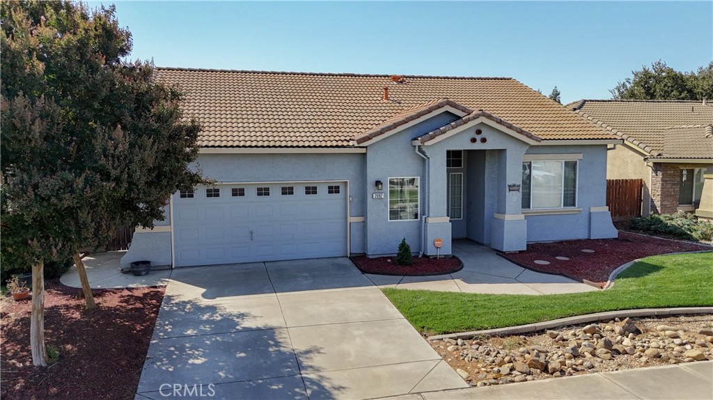 Elegance, serenity, and charm blend seamlessly within the highly desired American West gated community in Atwater! This coveted single story residence, 3 bedrooms, 2 bath (4TH BEDROOM Possible,) built in 2005, offers 1,716 square feet of refined living space with LAMINATE and TILE FLOORING throughout. Spacious, inviting living room that flows gracefully into a formal dining area, and could be a flex space. The heart of the home is the sleek eat-in kitchen with QUARTZ COUNTERTOPS, beautiful peninsula, ample cabinets, which opens up to a cozy family room adorned with a charming fireplace. The expansive primary bedroom suite is a sanctuary of comfort, featuring a BARN DOOR for privacy, generous walk-in closet, dual vanities, and a primary bathroom suite with lovely REMODELLED SHOWER. Two additional well-sized rooms for family or guests. The home boasts of QUARTZ COUNTERTOPS IN BOTH BATHROOMS, vaulted ceilings, butler's pantry, custom window coverings, updated light fixtures, ceiling fans, central heating and air conditioning, a durable tile roof, and a dedicated laundry room. Dual-pane windows, panel doors, handy RV Plug on the side of the home, convenient cement walkways around home that enhance the home's appeal. Outside, you'll find beautifully manicured landscaping, providing a private retreat with gazebo for relaxation and shed. Amazing location near shopping, restaurants and freeway access. Exclusive neighborhood park and playground, making it a perfect combination of comfort and convenience. Whether you're looking to upgrade, downsize, or settle into a well-maintained neighborhood, 2092 Patriotic Drive delivers it all. Don't wait!