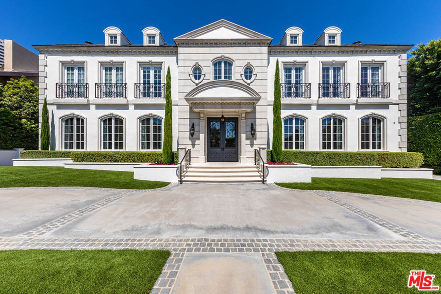 720 N. Alta is a classically styled European estate set on two-thirds of an acre in the coveted Beverly Hills Flats. This impeccably designed home is poised for exceptional indoor and outdoor entertaining and bordered by cyprus trees and tall hedges, adding to its exclusive, ultra-private atmosphere. The 7-bedroom, 14-bath home boasts sumptuous decorative details and amenities inside and out, from stunning vaulted ceilings, crown moldings and polished wood floors to an airy open-plan kitchen, home theater, fitness studio and wine cellar with attached tasting room. The manicured back lawn features an outdoor kitchen, lap pool, heated spa and fire pit. The home also boasts a garage with space for more than five vehicles and is equipped with a smart home technology system. 720 N. Alta is an impeccably designed find situated moments from the world-class shopping, dining and entertainment of the Sunset Strip, West Hollywood and Downtown Beverly Hills.