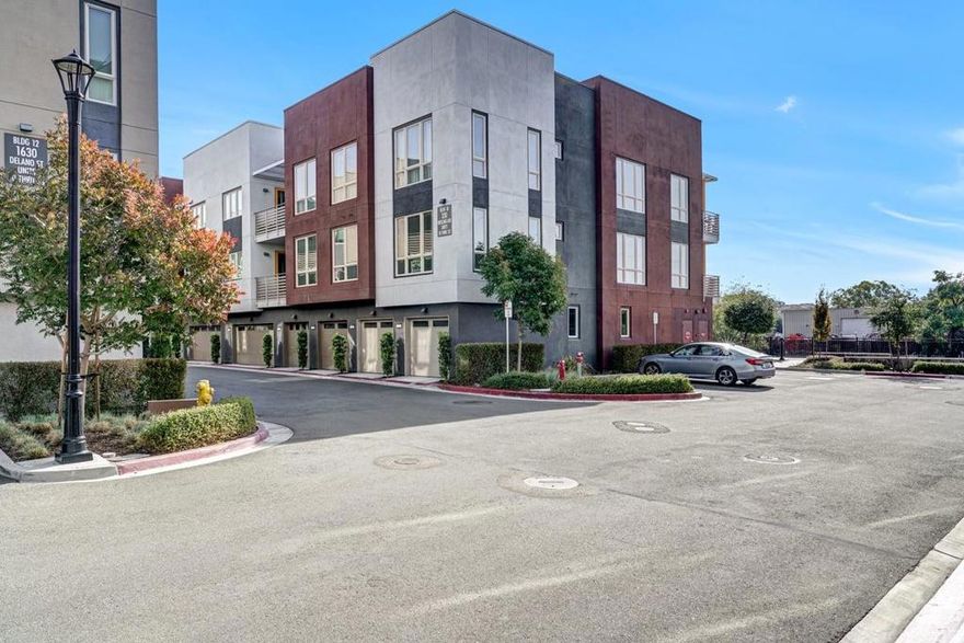 Welcome to your new home in the vibrant city of Milpitas! This charming corner/end unit residence offers 3 bedrooms and 2 full bathrooms and 1 1/2 bathroom all conveniently located on the second floor. The secured garages are tandem parking for 2 cars conveniently located below the unit on the 1st level. The spacious kitchen featuring a gas cooktop, granite countertops, and a suite of modern appliances including a dishwasher, refrigerator, and self-cleaning oven. Enjoy your breakfast bar or the dining area within the living room.  The home is adorned with a combination of carpet and tile flooring and a patio. Laundry is a gas hookup and washer/dryer located in the utility room.   This unit has both central AC and central forced air heating, while energy-efficient double pane windows and a tankless water heater add to the home's appeal, and fire sprinkler system. The property is equipped with modern conveniences such as an electric vehicle hookup midway in the tandem 2 car garage (Level 2, 240 volts).  Located within the Milpitas Unified School District, this home is ideal for families seeking convenience and comfort. This condo complex is located off Montague Expwy at the crossroads of The Great Mall/Capitol Expwys. Also centrally located to Hwys 880, 680 with light rail access.