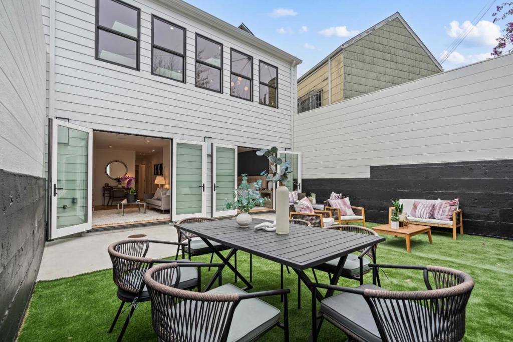Experience the perfect blend of Noe Valley & Bernal Heights charm in this modern luxury updated home. The main level features soaring 11-foot ceilings, elegant white oak floors, custom cabinetry with under-cabinet lighting, and five skylights that fill the space with natural light. The chefs kitchen is anchored perfectly with quartz countertops and premium Thermador appliancesa 6-burner cooktop, seamless hood, built-in microwave, and a smart fridge with camera. Two bedrooms and a stylish guest bath complete this floor. Downstairs offers a flexible entertainment area opening to the backyard, perfect for hosting. It also includes the primary suite, an additional bedroom, a family bath, and laundry space. Comfort features include radiant heating across six zones, attic heating, a tankless water heater in the attic, and a finished attic storage loft of about 100 sq ft. The home also has an alarm system, speaker wiring in living areas, Cat 6 wiring in every room and hallway closets, solar-ready infrastructure, plus new foundation, plumbing, electrical, roof, hardwood floors, windows, and sewer. A one-car garage with EV charger completes the package. Just steps from eateries, cafes, and shops, and easy access to I-280 and US-101, this home offers unmatched comfort and convenience.
