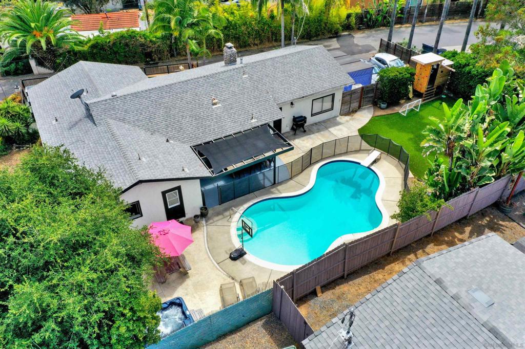 Secluded, sunny, and thoughtfully updated, this single-level home offers a rare combination of privacy, flexibility, and indoor-outdoor living. Situated at the end of a quiet, private lane with no through traffic, it features a spacious layout, multiple outdoor entertaining zones, and room to expand. Inside, you’ll find 3 bedrooms and 2 full baths, engineered hardwood floors, and an open living area that flows into a stunning remodeled kitchen with quartz countertops, soft-close cabinetry, vaulted ceiling with exposed beams, and built-in shelving. Both bathrooms feature fresh, modern finishes, and the home includes new ceiling fans, hardware, lighting, and paint throughout. The backyard is designed for enjoying the San Diego sun, complete with a sparkling pool, above-ground hot tub, direct outdoor access to a bathroom, and multiple patios framed by palm trees. Two separate driveways allow for additional parking, RV/boat storage, or potential for an ADU or guest space. The attached 2-car garage and nearly 1/3-acre lot offer abundant space and flexibility. Nearby, enjoy walking and biking trails to Vista Village, Brengle Terrace Park, and Moonlight Amphitheatre—without crossing major roads. A variety of top-rated, free public charter schools in the area provide exceptional options for educational programs in STEM, the arts, and language immersion. All just 15 minutes from the beach, with a perfect coastal breeze and minimal marine layer—perfect for enjoying the outdoors year-round.
