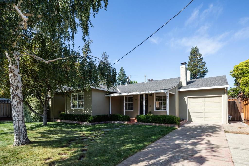 Nestled in the sought-after El Sereno neighborhood of San Carlos, this charming home welcomes you with timeless curb appeal and a cozy front porch. Inside, the living room features a classic brick fireplace, hardwood floors, and abundant natural light. The beautifully remodeled designer kitchen is a highlight with marble counters and decorative backsplash, top-of-the-line appliances, including a Wolf gas range, Bosch dishwasher and refrigerator, and a breakfast nook opening to the backyard. Counter seating flows easily into a family room for casual living, while a separate living room offers space for more formal gatherings. Two bedrooms and two updated baths include a serene primary suite with Zellige-tiled shower and marble vanity. The flexible layout provides an option to add a third bedroom to secondary living space if desired. Outside, enjoy a private yard with lawn, patio, and detached office shed with electricity ideal for work, fitness, or hobbies (permits unknown). With chic finishes throughout, this home combines style and versatility in a premier location near top-rated schools, parks, downtown San Carlos, and commuter routes for both 280 and 101.