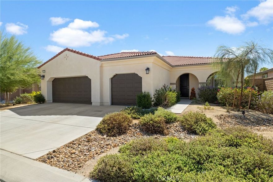This incredible 2022 new build in a beautiful gated community along the mountain range is a must see. The style and beauty of this particular home is not seen anywhere in the community. It is a 4 bedroom and 2 full bath with an incredible interior. The amount  of extras in the home are too many to detail. It is a smart home that you are able to control lighting, garage door, and appliances, as well as offers fire sprinklers throughout. With new water con serving landscape as you walk up to the home is a relaxing oasis and in the evening you can enjoy the large back patio. The solar panels are owned outright on top of a clay roof. The entry with office/workout/ reading area off to side, the new flooring is amazing and scratch and water resistance in the kitchen and living areas. The kitchen wide open has new quartz counters, Reverse Osmosis Flo water monitoring system, walk-in pantry, coffee area, new appliances, and a huge island for cooking and entertaining, the living room also wide open to the back and has the most relaxing atmosphere, and gas fireplace. Both have custom fans and lighting that is just enamoring. As you make your way to the bedrooms they are large and roomy, with tons of closet space, a common bathroom huge, that is bright and long counter and full bath with shower and bathtub. The laundry just off the inside separated and has its own storage on doors. Then you make your way to the master bedroom that is so spacious and bright with natural light much like the rest of the home, with the bathroom being wide open and beautiful. Also comes with tankless water heater and ring door system. With a large open backyard with grass area for pets or kids, nice open patio with lighting and fan perfect to relax in the morning or evenings. The garage is a 3 car garage with two charging stations of r electric vehicles both 220V. The home HOA includes internet and cable TV, parks and walking areas, and a playground. Awesome views of the mountain range. This home is near so many amenities, a growing community and a short distance to Joshua Tree national park.