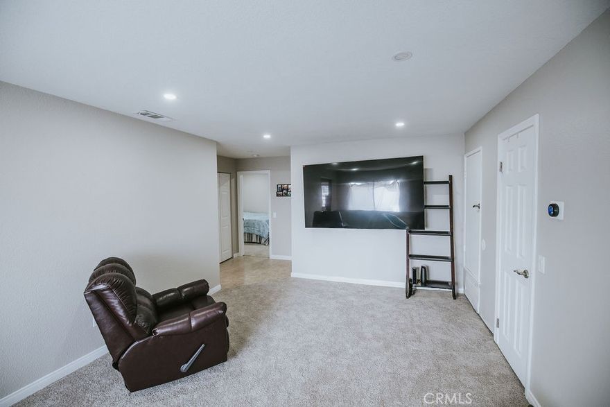 This beautifully remodeled home in "The Lakes of Corona" offers stunning park and mountain views. House is situated at the back; located on the second floor featuring two bedrooms and one bath. Inside, you will find a spacious kitchen and  washer/dryer hookups. The primary bedroom features a walk-in closet and access to a private balcony with park view, ready for you to enjoy while sipping your morning coffee. Bathroom recently upgraded with new bathtub. New carpet throughout, recessed light throughout paired with smart light- conveniently access from your smart phone.  Newer AC (super cold!). White kitchen with plenty of cabinet spaces. This condo is truly move in ready.  The community offers excellent amenities, including a scenic lake with a walking path, a pool, BBQ areas, tennis court, basketball court. Conveniently located near supermarkets, schools, and medical centers, with easy commuting access 91/15/71/241. First time home buyer? Perfect! Schedule your private showing today. This property may qualify for a Chase Homebuyer Grant that can be used to reduce the cost of your Chase mortgage. Please see supplement for info.