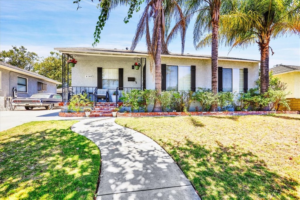 Such a GORGEOUS, REMODELED GEM of a home!! Sweetly nestled mid-block on a charming tree-lined street in an interior tract of a highly-coveted & centrally-located neighborhood, this darling jewel box is a fabulous, modern living space & a gracious place to call home!! Multiple tall palm trees, winding walkway & brick front porch amplify the wonderful curb appeal. Perfect blend of contemporary & charming inside, with an outstanding, expanded, open-concept floor plan! Formerly a three-bedroom home, it was transformed by previous owners taking away one of the bedrooms to design the open-concept living space & create the versatile & inviting great room. And the great room is the happy, connected heart of this home! Light, bright & airy w/great fluid use of space, this home provides such a soothing & serene vibe, a neutral color palette & a plethora of upgraded windows providing an abundant infusion of natural light throughout! Beautiful, refinished hardwood flooring, smooth ceilings, recessed lighting & ceiling fans. Stunning remodeled kitchen w/modern clean lines, fantastic kitchen island/breakfast counter, quartz counters, custom backsplash, custom lighting, engineered wood flooring, a truly generous amount of cabinetry & counter space, stainless steel appliances, modern fixtures & a convenient door leading to the backyard & patio. Beautiful upgraded bathroom w/double sinks. Central A/C, forced air heating, inside laundry w/storage cabinetry. Large backyard with covered patio is absolutely perfect for year-round lounging/relaxing, entertaining family & friends, savoring morning coffee or tea & a beer or cocktails during evening happy hours, BBQing & enjoying al fresco dinners! There appears to be possibility/room for expanding the home or adding an ADU for flex space/home office/gym/ multi-purpose room, multi-general living or renter. 2-car detached garage & a long driveway offers additional parking. Garage has built-in cabinetry & pull-down ladder. Fantastic, wide-ranging spectrum of nearby dining, shopping, entertainment, schools, churches, Long Beach City College, Long Beach Airport, parks, golf courses, other leisure & recreation & so much more, all just a leisurely stroll, a fun bike ride, skateboard ride or quick car ride away! Convenient access to transit, transportation routes & freeways. Long-time owners abound in this wonderful neighborhood. Don't miss out on this terrific opportunity! We welcome your visit & thank you so much for your interest! :)