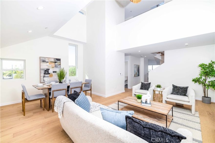 New construction with an ADU in the heart of University Heights, this residence blends modern amenities, views, and unmatched convenience just seconds from Park Blvd. Spanning 3,009 sqft, the home features three bedrooms and three-and-a-half baths plus a private-entry ADU with 12-ft ceilings, kitchenette, and full bath. Engineered white-oak wood floors, solid core doors, Andersen windows, and a private elevator define the home’s craftsmanship. The open-concept third floor showcases vaulted ceilings, 180-degree views, and a chef’s kitchen with GE Café appliances, matte-white cabinetry, honed-quartz counters, gold hardware, and a dry bar. The second floor hosts the primary suite with dual vanities and walk-in closet, an additional ensuite bedroom, and laundry. The fourth floor includes a loft ideal for a home office or retreat, a third bedroom, and full bath. A rooftop terrace offers two distinct lounge spaces with sweeping  views. A 12-ft-ceiling garage can accommodate a car lift, and paid-off solar panels and Tesla Inverter complete this energy-efficient home near Trolley Barn Park and Balboa Park.