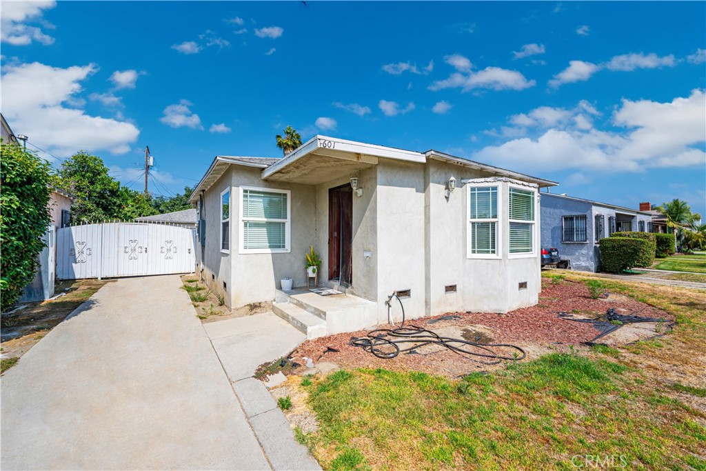 Welcome to Compton, CA!
This charming residential property offers a unique blend of character, space, and opportunity. Situated on an expansive 7,139 sq ft interior lot, the home features 1,605 sq ft of living space in the main house, which includes 2 bedrooms and 1 bathroom, coved ceilings, hardwood floors, and dual pane windows that provide both style and energy efficiency.
A cozy den adds flexibility for a home office, reading nook, or extra living space. The detached 2-car garage includes a laundry room and sits adjacent to a 1-bedroom, 1-bathroom unit (approx. 450 sq ft), perfect for extended family, guests, or potential rental income.
With plenty of room to expand, this property presents a fantastic opportunity to add an additional Accessory Dwelling Unit (ADU) and maximize value. Nestled in a quiet residential neighborhood, this home is ideal for both homeowners and investors alike.
Don’t miss your chance to own this versatile property in the heart of Compton!