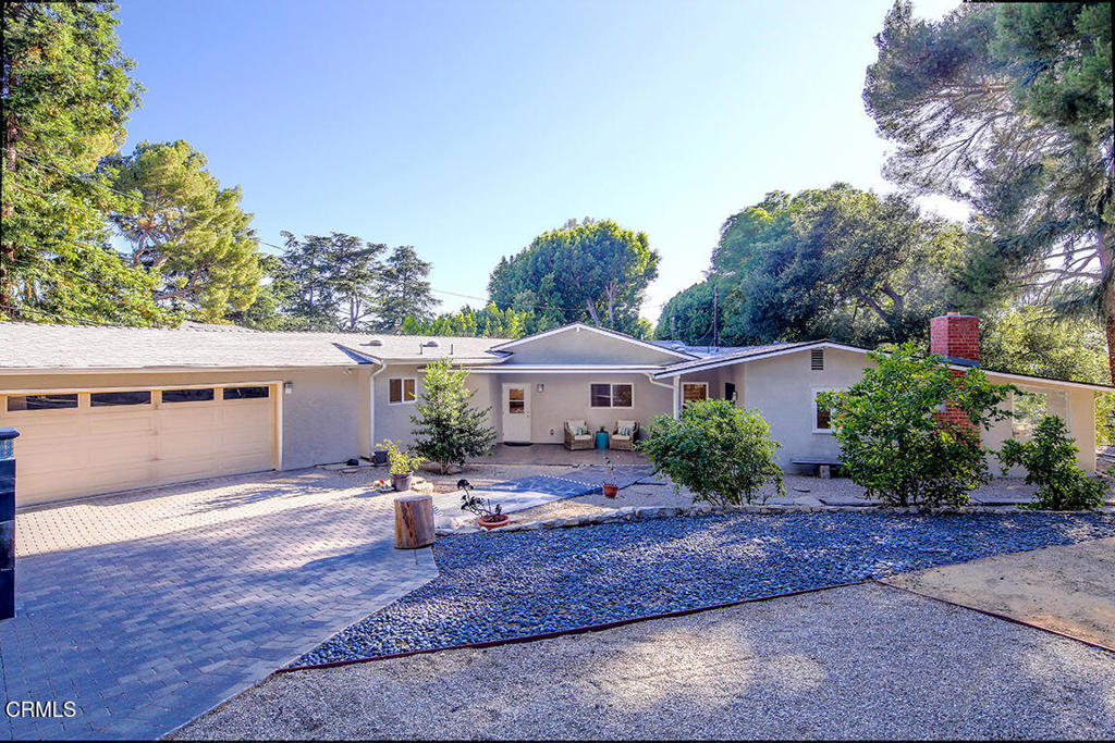 Nestled on over half an acre in one of LA's most desirable neighborhoods, this 4-bedroom, 3-bathroom home offers 2,718 square feet of warm, inviting living space. The heart of the home is a beautifully remodeled kitchen with high-end finishes and premium appliances, seamlessly flowing into expansive living and dining areas filled with natural light. The open layout and effortless indoor-outdoor connection make this home perfect for entertaining--whether it's intimate dinners or large gatherings under the stars. Set on a 23,770 sq ft lot with mature landscaping and incredible privacy, there's ample space to relax, host, or expand. Located on one of La Canada's most sought-after streets and just minutes from award-winning schools, this is a rare opportunity to own a truly exceptional property.