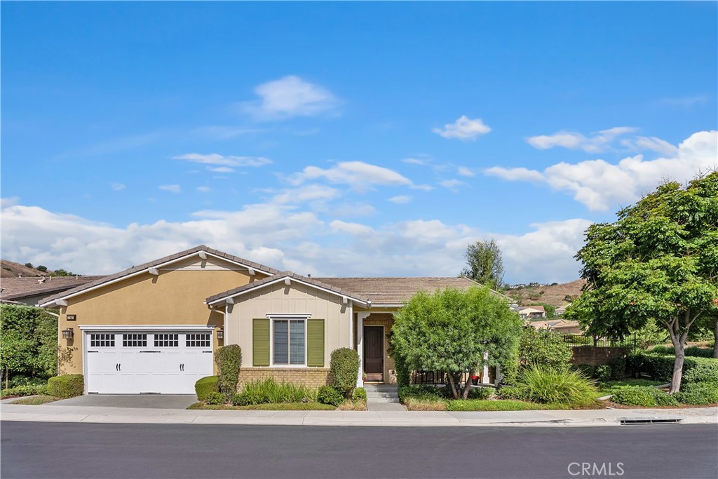 Live your best life in this beautiful single level home! This two bedroom and two bath plus den home is located in the exclusive gated community of Gavilan-Sendero in Rancho Mission Viejo ( 55+ community). This beautiful home features an open floor plan, chef’s kitchen with top of the line appliances, large kitchen island, exquisite granite counters, wood floors, luxurious primary suite, walk in closet and a large inside laundry room are just a few of the upgrades. Home is situated on a large corner parcel with views of the hills, picturesque garden and an ever so fun putting green. Close to “The Hacienda”, this gated clubhouse offers spaces for serious fun and relaxation. HOA amenities include a collection of indoor/outdoor community facilities set around scenic courtyards with panoramic hillside views, sparkling pools, fitness center, pickleball, and bocce play.