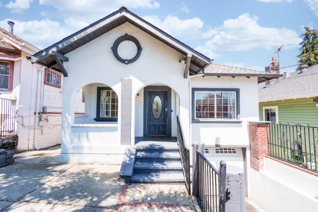 Welcome to 2036 E 20th St, Oakland, a charming and well-maintained two-story home in the vibrant San Antonio neighborhood! This 4-bedroom, 2-bath residence offers over 1,500 sq ft of light-filled living space with an inviting open-concept layout, refinished hardwood and laminate floors, and a kitchen remodeled just a couple of years ago featuring stainless steel appliances, custom cabinetry, and modern fixtures. Both bathrooms have been tastefully updated, and the flexible downstairs space is ideal for a home office, gym, guest suite, or future rental. The spacious lot offers mature trees, an outdoor fireplace, generous off-street parking, and room to entertain, garden, or explore, adding an ADU. Recent improvements, such as a newer roof, sewer lateral, sidewalk upgrades, and fencing, provide added value. With easy access to BART, bus lines, the 580 freeway, Lake Merritt, and Highland Hospital, this home blends comfort, convenience, and opportunity don't miss it!