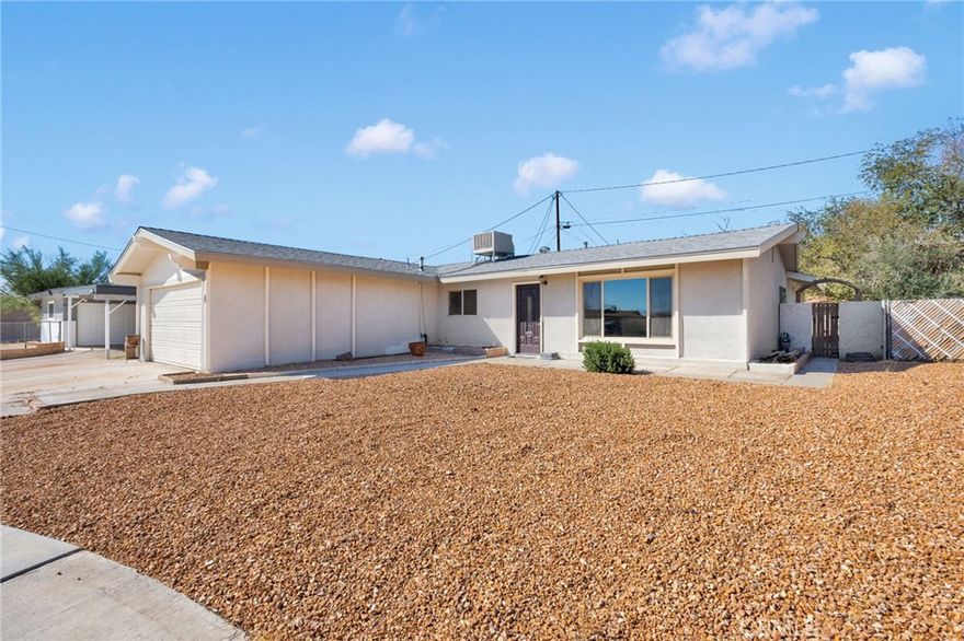 Welcome Home! This is a beautiful, turn-key property ready for a new family to enjoy! Home sits nicely in a cul-de-sac in a great community. This home offers a wonderful floorplan with 3 bedrooms and 2 baths. Brand new carpet and paint in all bedrooms. Walk into an open floor plan featuring many upgrades throughout the home. New windows, New carpet, New backsplash in kitchen, Newer stainless steel appliances, New Water heater and a NEW Evaporative cooler on roof. Also home has been painted inside and out and the exterior has been re-stuccoed. Kitchen has an abundance of both counter and cabinet space with a beautiful backsplash. Both bathrooms have been upgraded. All windows are double paned efficiency windows. Sliding glass door from kitchen leads to large, covered back patio with newer artificial grass for easy maintenance. This is a beautiful home waiting for it's next owners. Home is close to town and schools.