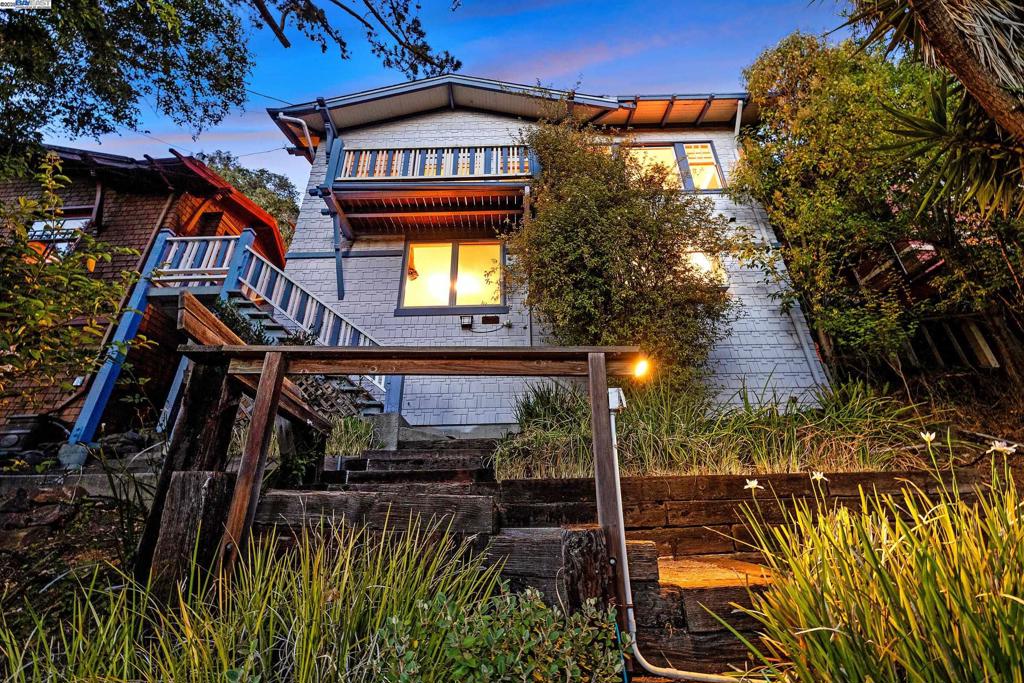 Magical Glenview Tree House! On the historic “Glendora Path” featured in the classic book ‘Secret Stairs: East Bay..” For those who love to walk and be amongst nature. Access via stairway up from Elbert St. or the Glendora pathway from Glendora Ave. Upon arrival the reward is views, privacy and natural light. Two bedroom/flex spaces upstairs as well as the kitchen, fire insert for heating and one bathroom. Large bedroom suite downstairs with full bathroom. Lovingly re-imagined by the owners with painstaking attention to the period details including restored windows, dining room with wainscoting and built-in breakfront with stained glass, doors with decorative hinges and door handles, in addition four rooms have picture molding and are internally wired for sound, surround sound in the living room and controlled sound in the kitchen. Skylights and stainless steel appliances, with restored maple cabinetry highlight the kitchen as well. The dining + living rooms have coffered ceilings and the wood floors are newly refinished. Lots of storage space; detached cottage can serve as office and subfloor access/boiler room has new energy efficient furnace and water heater. Lush outdoor spaces for gardening with rebuilt deck. A Special home for a discerning buyer. Experience serenity today!