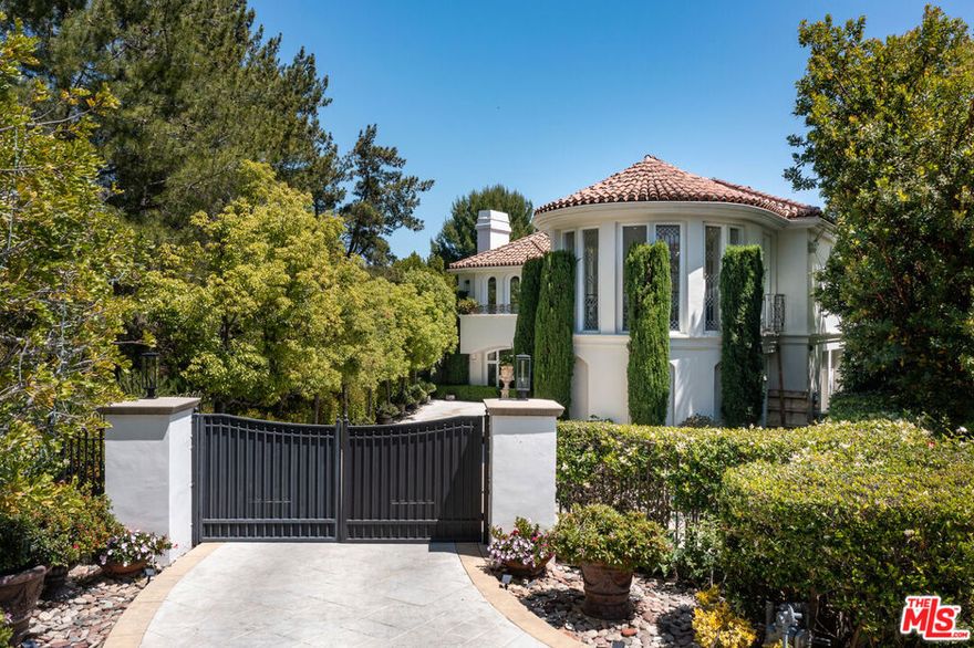 Rare opportunity to live in the highly sought after and exclusive 24-hour guard gated community of Bel Air Crest.This contemporary Mediterranean is hidden at the end of a quiet Cul-De-Sac, independently gated driveway providing more parking space in addition to amble street parking as there are only houses on one side of this street. Home is adjacent to the community greenbelt area providing the upmost in privacy while still enjoying views of nearby MountainGate Country Club golf course and tree top greenery.Stately impressions are made when entering this 3-story estate. Leaded glass double doors lead into the foyer where you are met with soaring ceilings and a glass cupola dome, flagged by a double winged staircase exuding elegance. Seamlessly flowing into the formal dining room with French doors leading out to a 1,000 sq ft plus balcony overlooking the backyard and pool. The main level also boasts a gourmet kitchen, family room with fireplace, living room with fireplace, powder room and luxurious office space with built in bookshelves and a balcony. The upper level features an exquisite primary suite retreat with a private balcony, wet bar, double sided fireplace, steam and sauna in the newly renovated his and hers bathrooms and closets. There are 4 additional en suite bedrooms, one of which has its own private staircase entrance. The Garden level has 2 additional en suite bedrooms, a home theater, living/dining area with built in bar, wine cellar, gym, pool bathroom with shower, and laundry room with both indoor and outdoor access from the garden. The backyard is an entertainers dream with an additional 1,000 square feet covered patio complete with ceiling heat lamps, a built in BBQ and bar area, covered gazebo and beautifully redone pool and adjoining spa. Outdoor living in California at its best with these large entertaining areas surrounding the pool in addition to the outdoor balcony on the main floor. The community of Bel Air Crest offers 5 tennis courts, basketball courts, a dog park, playground and a newly renovated clubhouse with a well-equipped gym, meeting room, lounge space and kitchen.