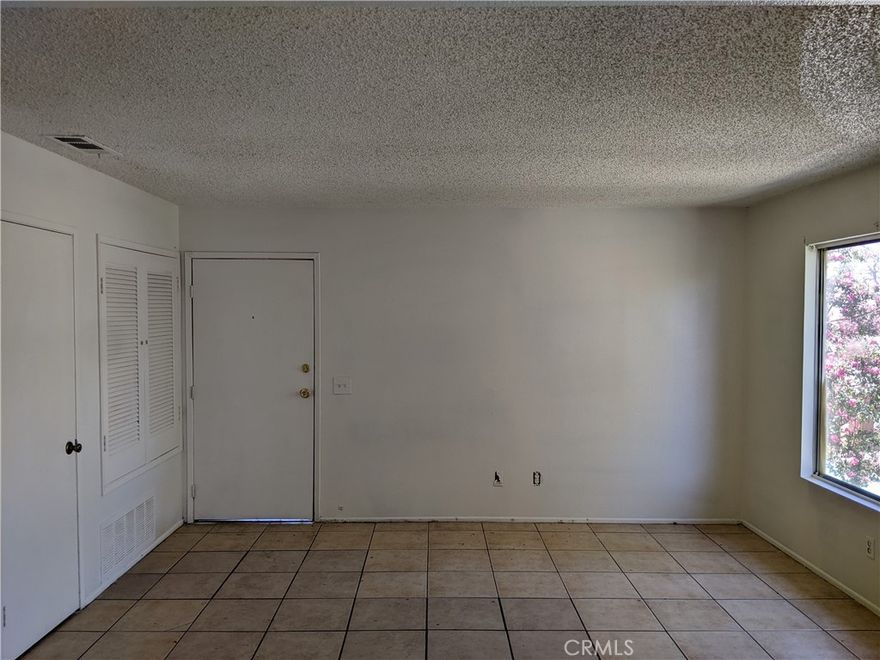 2nd story condo with new paint, new carpet. It's located adjacent to the pool and mailbox areas. 

One car garage + one reserved parking spot. The gated community does have guest parking as well.