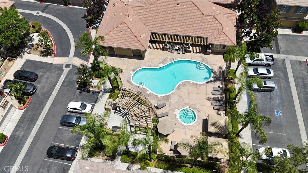 Come see this beautiful two story home in the exclusive gated community of Brookview Terrace. This Condo has 1565 square feet of living space and has 3 bedrooms and 2 and a half bathrooms. If you enter from the 2 car garage, you'll find professionally installed wooden cabinets and an epoxy floor. Enter from the front door and you'll encounter the living room area where you'll be welcomed by shuttered window coverings and a cozy fireplace for cold winter nights. In the the kitchen you'll find all stainless steel LG appliances and stone counter tops. Walk upstairs and you'll see the hallway loft area with a built in desk. Also, two bedrooms and a full bathroom accompany the upstairs, while the master suite has 2 walk-in closets and boasts an elegant full bathroom with soaking tub. Finally, there's a separate laundry room with an LG washer and dryer which convey, and the entire unit has wall-to-wall laminate flooring. Let's talk about the Club House,... Pool, Spa, Child Daycare Playroom, Steam room, Dry sauna, Gym, Conference room and Meeting room. This place has it all!