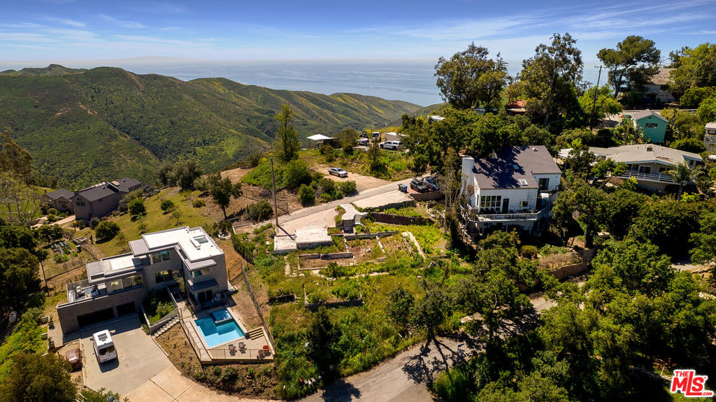 One of the last Woolsey fire burn out lots available in Malibu. Light and bright, this just under a quarter of an acre property nestled in Corral's beautiful Upper Bowl boasts wide open, amazing mountain and canyon views throughout and distant ocean and city views from a second story. Previous construction was two story, 3 bed/3 bath, 2,109 sq ft. Take advantage of this rebuild process and possibly add an additional 10% with reconstruction. Conceptual Models courtesy of renowned designer Vitus Matare & Associates. The possibilities are endless - don't miss out on your opportunity to build your dream canyon retreat, just minutes from PCH and some of Malibu's most beloved beaches and hiking trails!