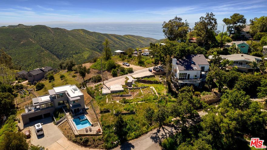 One of the last Woolsey fire burn out lots available in Malibu. Light and bright, this just under a quarter of an acre property nestled in Corral's beautiful Upper Bowl boasts wide open, amazing mountain and canyon views throughout and distant ocean and city views from a second story. Previous construction was two story, 3 bed/3 bath, 2,109 sq ft. Take advantage of this rebuild process and possibly add an additional 10% with reconstruction. Conceptual Models courtesy of renowned designer Vitus Matare & Associates. The possibilities are endless - don't miss out on your opportunity to build your dream canyon retreat, just minutes from PCH and some of Malibu's most beloved beaches and hiking trails!