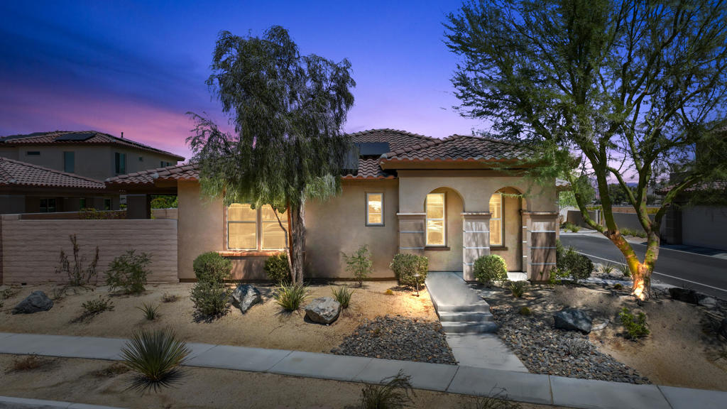 Welcome to Genesis in Palm Desert - modern living in a private, gated community built by award-winning local builder, GHA Companies.This beautifully upgraded 2-bedroom + den/bonus room home sits on a desirable corner lot and offers 1,652 sq. ft. of light-filled living space. The flexible floor plan includes a bonus room with custom built-in cabinetry--ideal for a home office, formal dining, or conversion into a 3rd bedroom.The open-concept kitchen is designed for both style and function, featuring stainless steel appliances, a center island, abundant cabinetry, wine refrigerator, and a designer tile backsplash. The spacious great room flows seamlessly to the backyard, where you'll enjoy a fire pit, artificial turf, and low-maintenance landscaping--perfect for entertaining or relaxing outdoors. The primary ensuite offers a luxurious retreat with an oversized walk-in tiled shower, dual vanities, and a generous walk-in closet. A secondary bedroom and full bath provide comfort for family or guests, while a separate laundry room, solar system and 2-car garage add everyday convenience. Genesis residents enjoy resort-style amenities, including a sparkling pool, spa, fitness center, BBQ area, outdoor showers, dog parks, and scenic walking trails--all with low HOA dues that includes front yard maintenance, direct tv and internet. With its central location near shopping, dining, Acrisure Arena, and quick I-10 access, this home offers the perfect balance of comfort, lifestyle, and convenience. This home will a make great primary residence, second home getaway, or investment property.