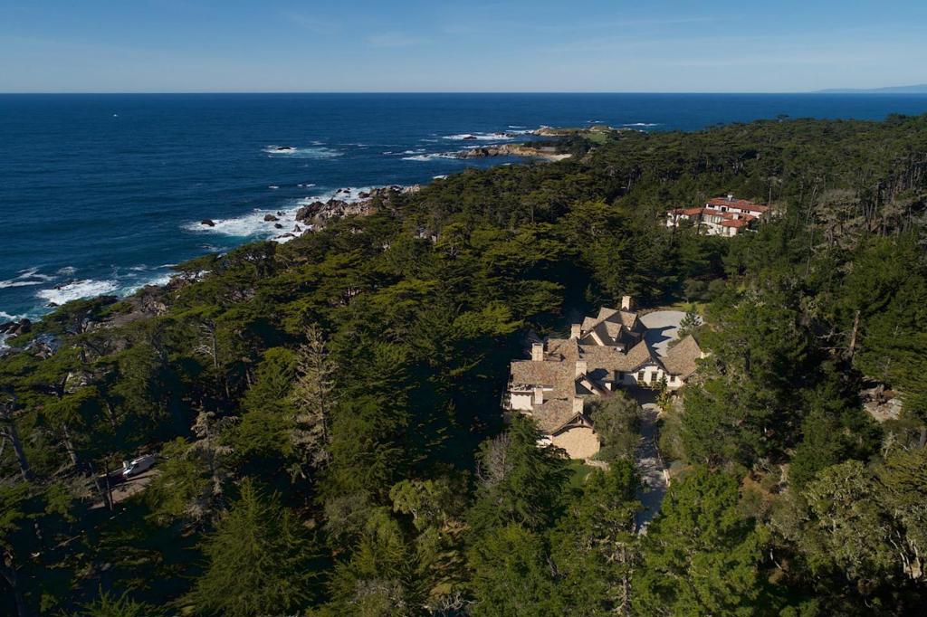 StoneGate Manor is an exceptional estate, sited on one of only 21 parcels of real estate on 17 Mile Drive between Cypress Point Golf Club and the iconic Lone Cypress, among the most recognizable and desired locations in the world. The Pacific Ocean glistens through a stand of Monterey Cypress, and the waves, together with the sounds of seals and birds, create a soothing symphony. The home compliments and enhances its surroundings, as if has always been there. Completed in 2002, it has the timeless feel of a proper English country estate. No expense was spared in its construction, a true labor of love for the owner. A team of more than one hundred craftsmen labored for more than two years on the project. Modern conveniences are present but cleverly concealed from the eye. Thoughtful design created a floor plan that well accommodates the lifestyle of a family but stands ready to welcome and entertain multiple guests with privacy for all.