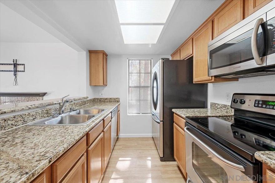 This inviting corner-unit condo blends comfort and convenience with a cozy living-room fireplace, private balcony, full-size in-unit washer/dryer, and sleek stainless steel appliances. Ideally positioned on the second level near the community’s top amenities—pool, clubhouse, tennis and basketball courts—you’ll also enjoy ample guest parking and your own reserved space right out front. With quick access to the 15 and plenty of nearby dining and shopping, this charming home is a must-see.