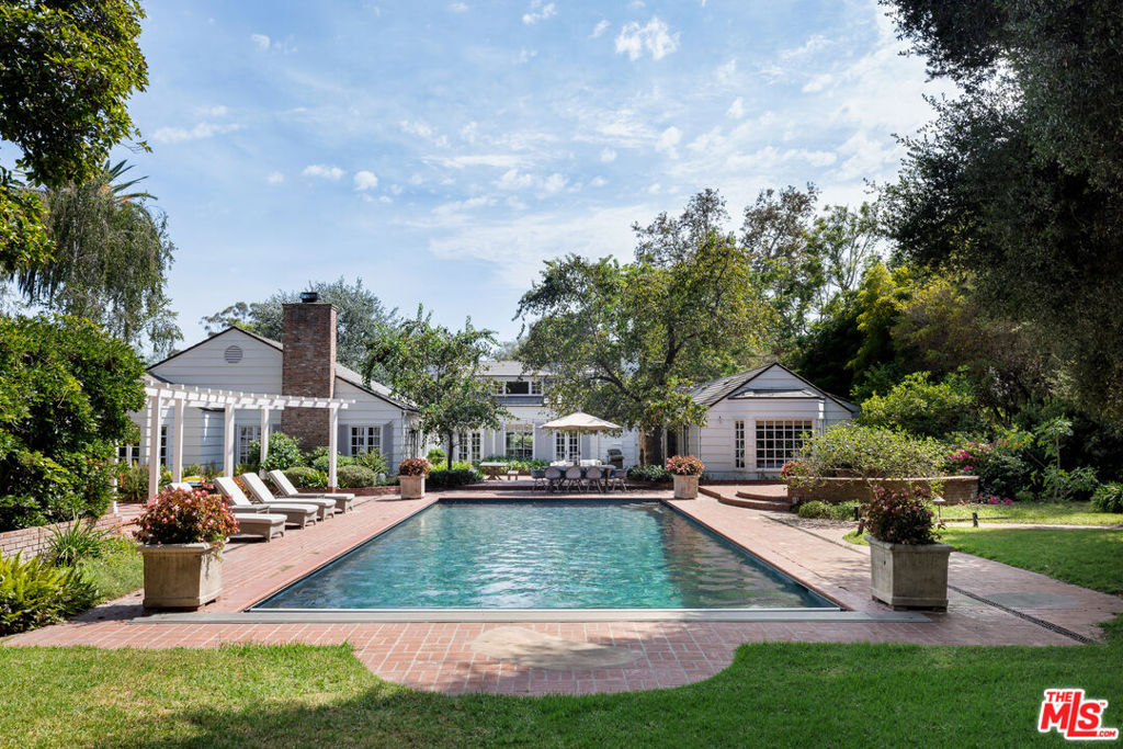 A one-of-a-kind Harriet Moody storybook cottage nestled on nearly 1 acre in Montecito's highly sought-after Hedgerow neighborhood. Step inside and prepare to be captivated by the warm and serene ambiance that permeates every corner of this home. Vaulted ceilings and abundant natural light create an open and airy feel, while cozy fireplaces and built-in bookcases invite moments of relaxation. The beautiful wide-oak flooring adds a touch of modern elegance to the classic design. Enjoy meals in the cozy breakfast nook of the gourmet kitchen or the intimate formal dining room. Dual primary suites on the main floor offer superior privacy, while the upper level boasts two additional suites with vaulted open-beam ceilings. Outside, a roomy brick courtyard with an outdoor fireplace overlooks the pool and hot tub. Beyond the pool, you'll find a lush lawn, mature oaks, fruit trees, and an inviting gazebo. The 1 bed/1 bath guest house offers over 500 square feet of living space. This beautiful property has been renovated by DD Ford, making it the perfect blend of luxury and charm. Located in the desirable Montecito Union School District, this home is just minutes away from the beach and Montecito's Upper and Lower Villages. With its impeccable design, high-end amenities, and prime location, 1564 Ramona Ln is the epitome of comfortable, luxury living.