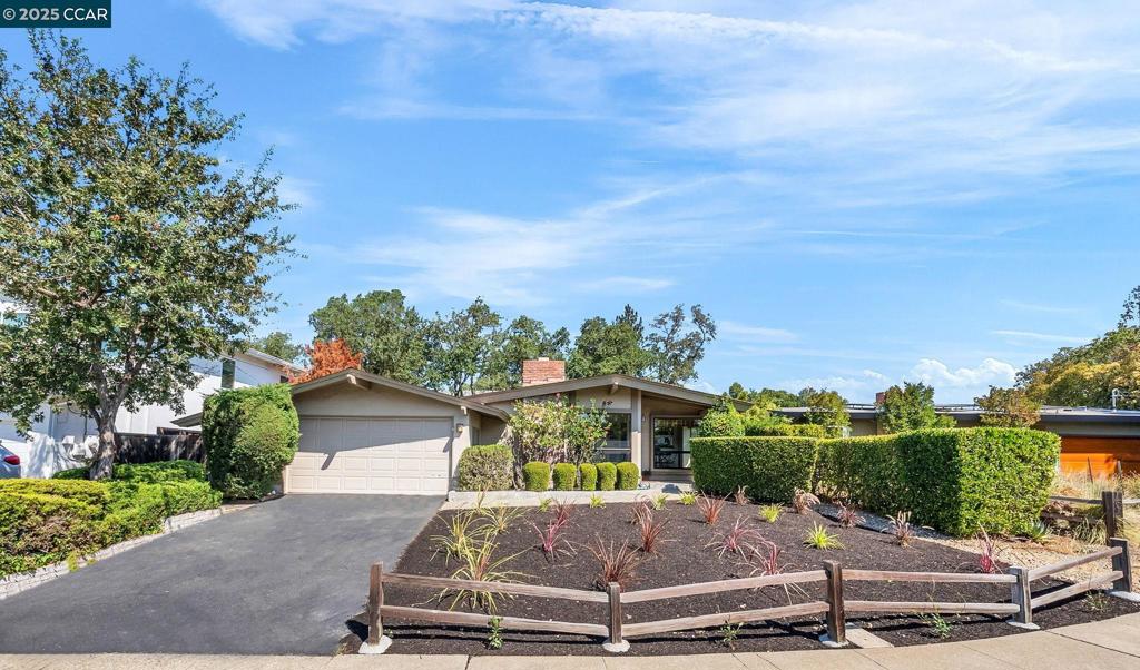 Mid-century modern style & character tucked into a quiet court in the desirable Parkmead neighborhood! The spacious living area has vaulted wood-beam ceilings, contemporary ambience, gleaming hardwood flooring, a cozy fireplace and sliding doors opening to a lush and private courtyard patio. An East-facing kitchen brings in the morning sun to start your day, has been impeccably maintained and offers great space for future improvements! The primary suite is spacious with a sitting room looking out to the peaceful pool setting. Other amenities include: central HVAC system, convenient interior laundry, walls of windows looking out to the private garden setting and an attached garage with storage. The serene and private setting features a courtyard trellis arbor, spacious entertaining patio, and colorful & fragrant gardens brimming with jasmine, lilac, boxwood, lavender, hibiscus and more. A sunny splash pool area boasts a sunbathing deck and plenty of room for future landscape improvements. Prime location on a pristine court surrounded by verdant hills, and just a short stroll to top-rated K-12 schools, shopping and restaurants, and easy commuting access.
