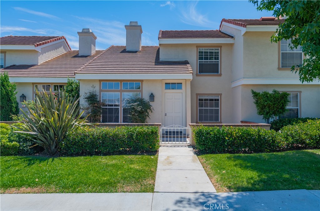 Light and bright 3-bedroom, 3-bathroom townhome in the popular University Town's Cambridge Court community. This home is just a short walk from UC Irvine and the award-winning University High School. The spacious floorplan includes dual master suites upstairs, each boasting a skylight in the bathroom for abundant natural light. Open kitchen that flows into a separate family room with direct access to an oversized two-car garage. Enjoy the private atrium with French doors, a formal dining area, and a large living room with a fireplace and vaulted ceiling. Additional features include hardwood flooring, built-in cabinets, and fresh paint throughout. Move in ready 9/1/25