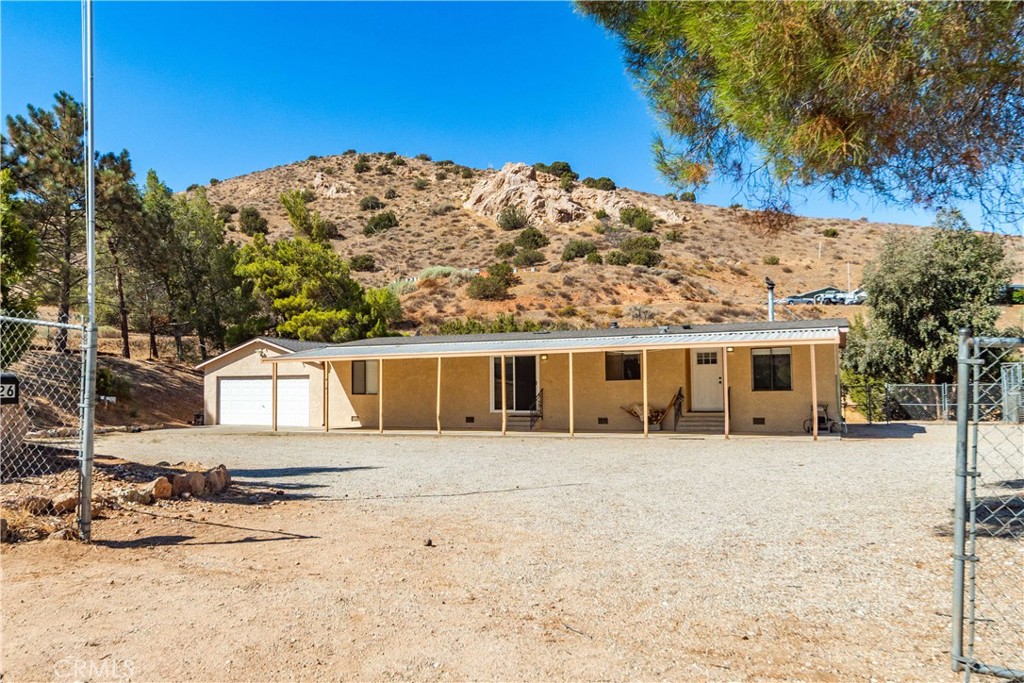 Country Living Home with Mountain Views in Acton’s Country Way Estates
Nestled between the Sierra Pelona and San Gabriel Mountains, this beautifully updated 2-bedroom, 2-bath home sits on 1.39 acres in the desirable Country Way Estates neighborhood.
The remodeled kitchen features newer cabinets, Corian countertops, a Farmhouse Sink, a Thor 6-burner stove/oven, and a walk-in pantry—a dream for any home chef. The living room is warm and inviting with wood beam accents, and a wood-burning stove. Home has recessed lighting in kitchen, living room and hallway, ceiling fans in dining area and bedrooms, luxury vinyl plank flooring, and fresh paint throughout. Primary suite has a walk-in closet with built in closet organizer.
Enjoy the outdoors with expansive mountain views, RV hookups, kennels, a metal storage building, and an attached 2-car garage. The property is set on a paved road with county water, natural gas, and mature trees, blending comfort with country charm.
Located minutes from Pacific Crest Trail, Vasquez Rocks, Angeles National Forest, and Acton Wash Sanctuary, this home is surrounded by endless recreation. The town of Acton offers grocery stores, gas stations, restaurants, coffee shops, a feed store, a tack store, and Acton Park—all just a short drive away.
This is your chance to enjoy quiet country living with modern conveniences.