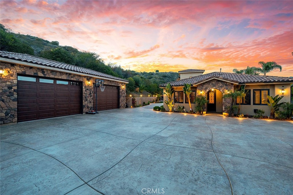 PRIVACY, LUXURY & ENERGY EFFICIENCY ON 10 ACRES WITH NO HOA! ABSOLUTELY TURNKEY RESORT-STYLE ESTATE WITH AMAZING VIEWS ON THE SANTA ROSA PLATEAU! $100s of thousands invested in new solar, massive battery-back up & whole-house generator, providing security, connectivity & controlled cost of living. Extreme privacy from the moment you enter this one-of-a-kind custom estate located in a convenient, tranquil location adjacent to La Cresta, in a small carved-out area with NO HOA. The custom iron entry gate, peaceful waterfall, long driveway, and extensive landscaping greet you, leading you to the large, beautifully finished 4-car detached garage, dramatic Mediterranean-inspired estate with a pool and an entertainment backyard that you must see to believe! The acreage adjacent to the home has a separate driveway, stairs, walls, fruit orchard, and is ready for whatever you want to build. Inside the home, find 8-ft solid wood doors, hand-troweled walls, Fiber Optic Internet Service (FIOS) wifi, surround sound, security system, custom shutters, and opening to the family room, the epic chefs’ kitchen with Viking appliances, 4 ovens, cooktop with griddle & pot filler, 2 sinks, 2 dishwashers, large eat-in island and adjacent well-equipped walk-in butler’s pantry. The Primary Suite and 2 additional ensuite bedrooms PLUS OFFICE are downstairs, with 2 additional ensuite bedrooms and large viewing deck upstairs. The backyard amenities include pool with ‘Lazy River’, 11 swim-up seats, sunken bar, 3 fridges, ice maker, dining counters, 2 TVs, sink, 52” BBQ, palapa, horse-shoe pit and city-lights & Nature Reserve views. The interior/exterior audio system tops off the resort experience! Just bring your toothbrush! THIS CLOSE-TO-TOWN ESTATE IS TURNKEY LUXURY! *****Discover the Santa Rosa Plateau Lifestyle…5-acre minimum parcels (10-acre minimum. in SR West), just minutes to schools, restaurants, hospitals, grocery stores, 15 Fwy & Temecula Wine Country. Enjoy this peaceful ranch community w/no commercial businesses, robust social activities, miles of private community trails & 1000s of acres of Ecological Reserve…All less than 1.5 hours from LA, SD, OC, Palm Springs & Big Bear. Discover the country, yet convenient, lifestyle of La Cresta, Tenaja & the Communities of the Santa Rosa Plateau!