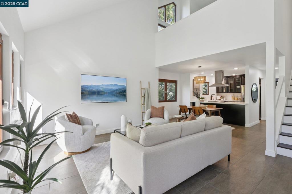Imagine living in this exclusive retreat at the end of a cul-de-sac featuring soaring ceilings, windows with views to the majestic trees and peaceful landscape that has been tastefully remodeled from top to bottom! This end unit is filled with soft light and enjoys two ensuite bedrooms (or make one an office), with open floorplan, designer kitchen with quartz counters and stainless steel appliances and nearby laundry closet. You'll love sitting on the front patio adjacent to the greenbelt or relaxing on the balcony overlooking the trees with peek-a-boo views of Mt. Diablo. The designer bathrooms complete the feeling of escape as does the wooded pathways, swimming pool, picnic area, and basketball court in the complex. One-car garage and visitor parking at the end of a quiet cul-de-sac, yet near shopping, transportation, freeways, schools, hiking trails, and parks. Open house 10/11 & 10/12 1-4 pm