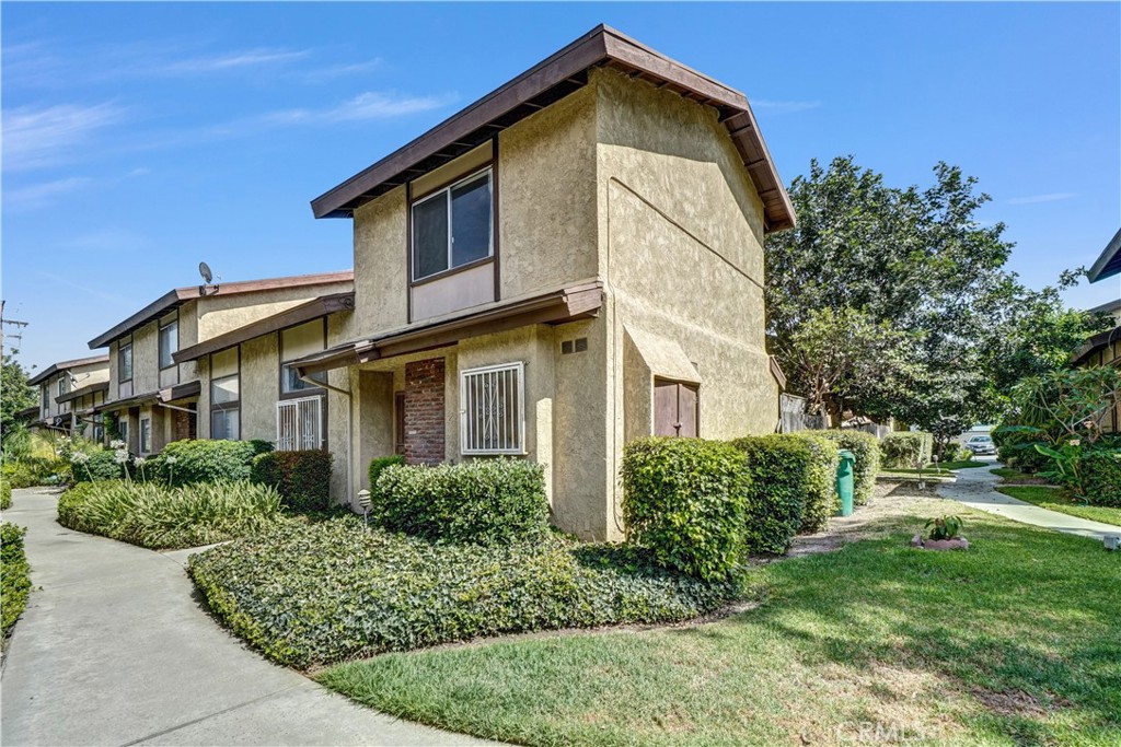 This desirable condo offers 2 spacious bedrooms and 2.5 bathrooms in Baldwin Park. It offers enhanced privacy and an abundance of natural light, creating a bright and airy atmosphere throughout. There are many recent upgrades including new luxury vinyl plank (LVP) and carpet, new kitchen, new bathrooms, new interior paint... and more. Inside, you'll find LVP flooring throughout the main living areas & bathrooms and carpet in the bedrooms, stairway, & upstairs hallway. The layout features a dedicated dining area with direct access to both the private patio and the attached garage ~ perfect for convenient everyday living. Enjoy a comfortable family room complete with a fireplace & vaulted ceiling ~ perfect for relaxing or entertaining. The primary suite includes a walk-in closet and an en-suite bath for added comfort. Additional highlights include an attached garage, abundant natural light, and a quiet location.