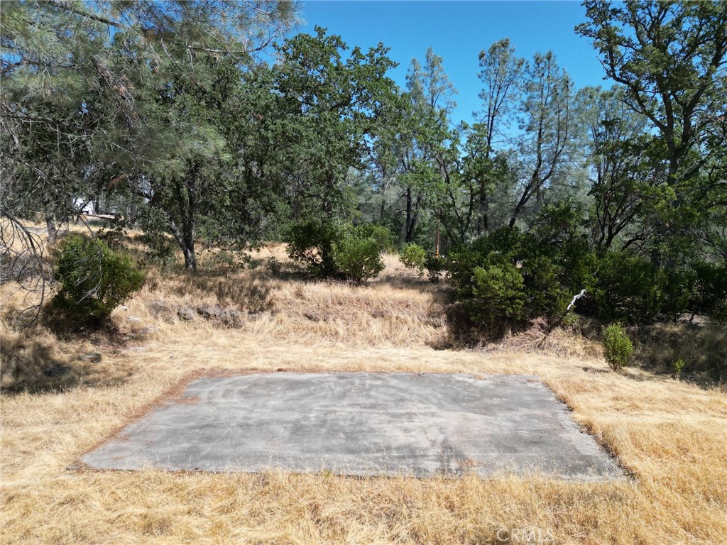 Escape to serene countryside living with this expansive 2.38-acre parcel in the sought-after Rancho Tehama Association. Nestled in a tranquil rural setting, this land offers a perfect blend of privacy and community amenities. This property already has a well and septic along with a concrete pad waiting for you to build your dream home! Enjoy the benefits of the HOA amenities such as an airstrip, community park, and a future community pool.