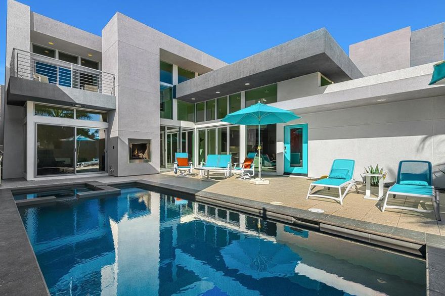 The perfect blend of indoor/outdoor living in this modern home located in the heart of downtown Palm Springs! Convenient  to restaurants, shops, and all that downtown has to offer. SOL is a gated community of 46 private residences. The home's contemporary design features an open floor plan with expansive walls of glass and collapsing doors, seamlessly merging your entertaining spaces  making it ideal for gatherings. Step inside to soaring ceilings and natural light. The kitchen is a standout with its oversized island, bar seating, ample cabinetry, and sleek quartz countertops. The home has two Primary Suites--one on each level--providing excellent separation and privacy. The upstairs loft offers versatile space that can serve as a sitting area, home office, or personal gym. Outside, enjoy your private pool and spa area, complete with a cozy outdoor fireplace for those cooler Palm Springs evenings. Recent upgrades include owned solar panels, dual variable speed Trane heat pumps, an electric car charger, a tankless water heater, pool pavers, Pentair Wi-Fi equipment, a Culligan water softener, remote electric shades, and enhanced landscaping with lighting. Combining luxury, functionality, and modern design.