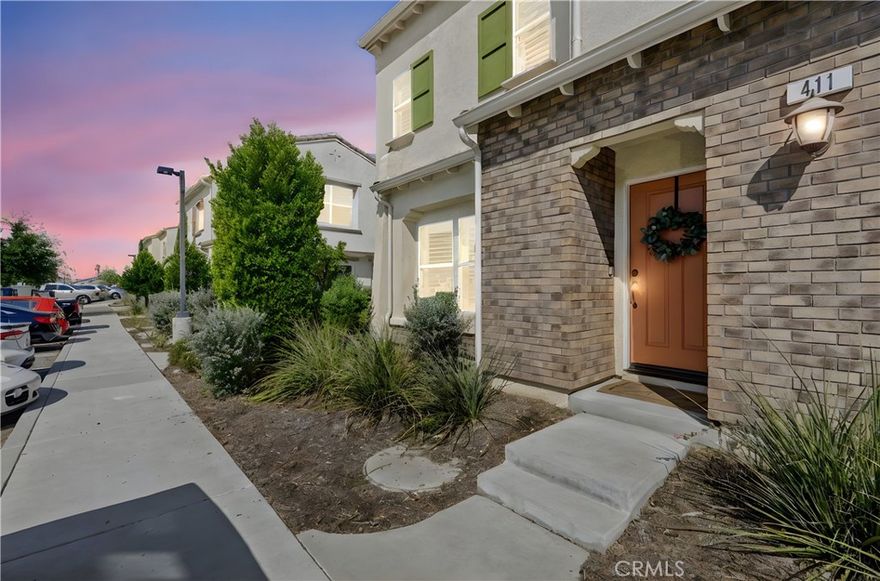 Fontana – Gated Community! Welcome to 7155 Citrus Ave, Unit 411. This original owner model-like end unit condo offers 3 bedrooms, 2.5 bathrooms, and 1,687 sq. ft. of modern living space. Located in a secure community with low HOA fees, right across from the pool and spa. Interior highlights include upgraded flooring, quartz countertops, recessed lighting, wood shutters, custom shading, and a stylish backsplash with stainless steel appliances. The primary suite features a spacious bathroom and large walk-in closet. The additional two bedrooms and spacious loft offer flexibility for family, guests, or a home office, making this home ideal for today’s lifestyle needs—along with a laundry room conveniently located upstairs for even more comfort. The garage includes epoxy flooring and an EV charger. This home also comes equipped with solar for energy efficiency. The community provides resort-style amenities—pool, clubhouse, sports court, parks, and walking paths—plus convenient access to Victoria Gardens shopping, dining, and freeways. Truly move-in ready!