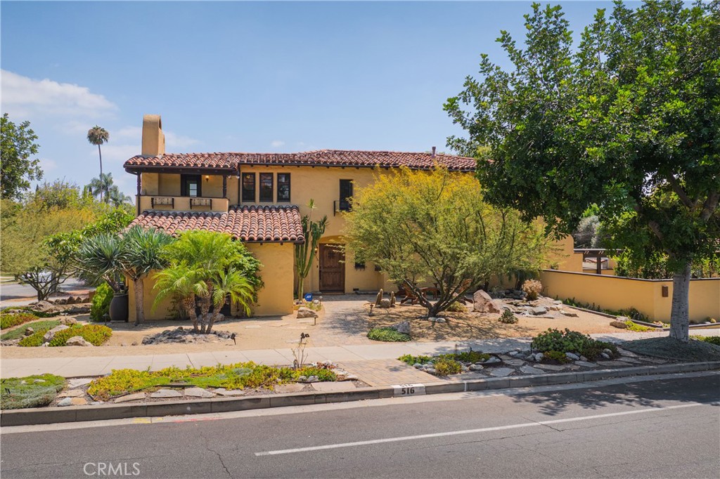 Character-rich fully updated two-story Spanish Revival on prominent corner in the pending Bellehurst Historic District of Glendale's sought-after Rossmoyne neighborhood. Originally built in 1929, this home features loads of original character detail including oak hardwood floors, period archways, wood casement windows, a recently redone red tile roof alongside tasteful modern upgrades including a newer granite and stainless Kitchen, newer Bathrooms, upgraded systems and a spacious entertainer's back Patio with oversized SwimSpa. The flexible floorplan includes a ground floor Bedroom suite with attached 3/4 Bathroom just off the Kitchen (presently staged as a Den), a separate Office space off the large formal Living Room and on the second floor is a huge Primary Suite with updated dual-sink Bathroom and covered balcony with lovely views of the foothills. Down the hall are two additional spacious Bedrooms that share an updated Jack & Jill full Bathroom. Featuring high-end Thermodore stainless appliances, the updated Kitchen is massive and has a Breakfast Bar, the home's formal Dining Area and access to the back Patio through the Laundry Room. The back Patio is truly fabulous with a pergola covered BBQ and dining area, an outdoor entertainment center with large flat screen TV and a big SwimSpa great for exercising or just relaxing with friends. System upgrades included dual zone HVAC, copper plumbing, 200 amp panel, seismic bolting, central vacuum and more! The detached two-car Garage has plentiful storage. Near to TJ's, religious services, charming restaurants and cafes along No. Brand, Equinox gym, the Americana and the 2, 5 and 134 fwys.