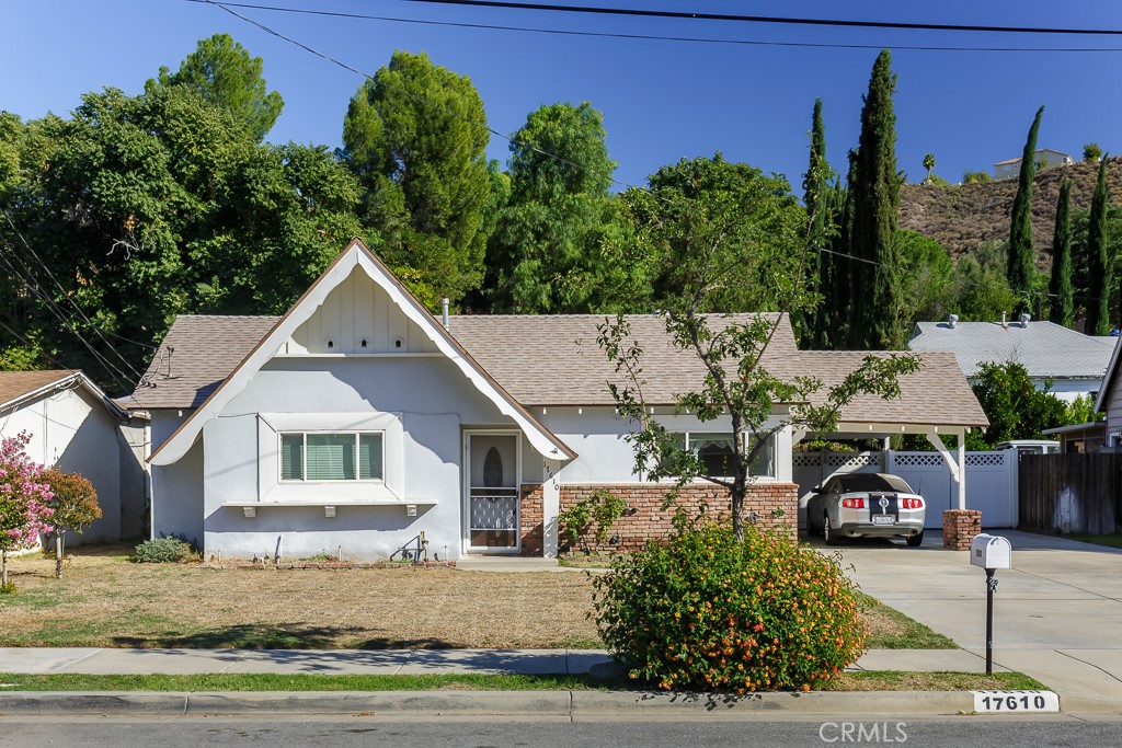 Located on a quiet street in the Mint Canyon area of Canyon Country, this 2-bedroom, 1-bath home sits tucked beneath the hills on an expansive 8,575 sq. ft. lot. The property offers an ideal opportunity for the buyer ready to roll up their sleeves and unlock this home’s full potential.
The efficient floor plan features a bright living room, a galley-style kitchen with granite counters, and a full bath finished in neutral stone tile. Comfort upgrades include central heating and air conditioning, energy-efficient vinyl windows, and a sliding glass door leading to the backyard.
A long driveway and carport provide ample parking, while the covered patio spans the entire rear of the home—perfect for shaded outdoor living. The deep backyard offers privacy, two storage sheds, and plenty of room for gardens, play areas, or future expansion.
A solid Canyon Country opportunity with space, quiet, and promise.