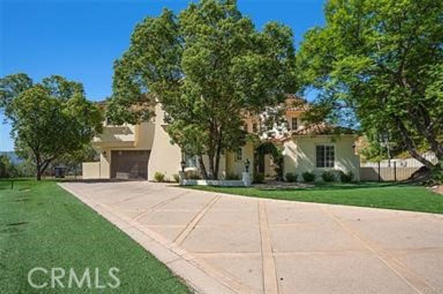 Resort-Style Living with 360° Views in Calabasas Park Estates. Welcome to your private retreat in the exclusive gated community of Calabasas Park Estates! This stunning estate offers over 5,400 square feet of luxury living, featuring 5 spacious bedrooms, 5.5 bathrooms, and breathtaking 360-degree views from nearly every room. Step inside to find a thoughtfully designed layout with a gourmet eat-in kitchen, built-in home office, and a grand primary suite complete with panoramic views, a spa-inspired bathroom, and an expansive walk-in closet. A large bonus area and full gym add to the versatility of the space, while two elegant staircases provide a touch of sophistication and convenience. Your backyard is a true staycation paradise—designed for both relaxation and recreation. Enjoy a sparkling pool with swim-up bar, pickleball and bocce ball courts, a basketball zone, yoga retreat, built-in BBQ area, and lush, park-like grounds. This home is the perfect blend of luxury, comfort, and lifestyle in one of Calabasas’ most sought-after communities.