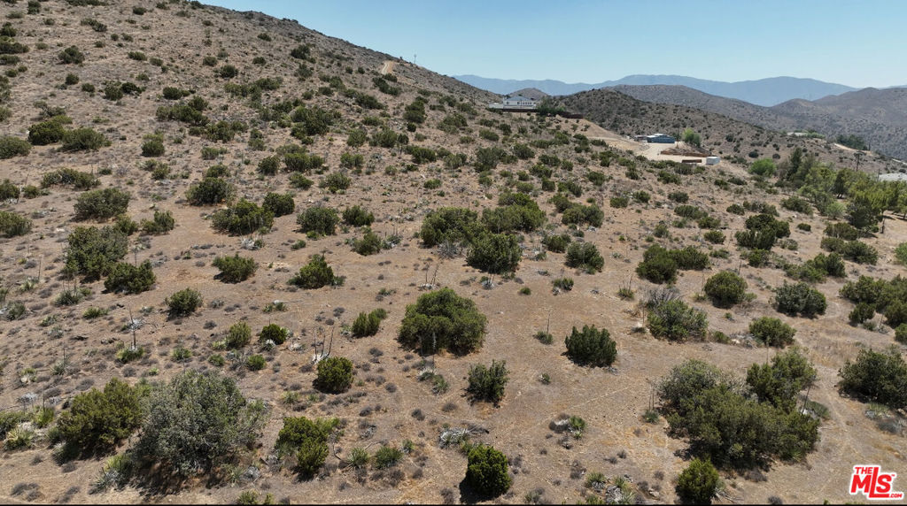 Spacious 10+ acre lot with beautiful views, ideally located near single-family homes and charming ranch properties. This rare offering provides the perfect balance of privacy and open space in a peaceful rural setting. With endless possibilities and strong potential.