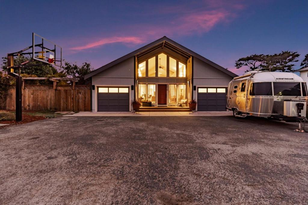 Beautiful 3BD/2BA, 1,960 sq. ft. coastal home just steps from Seal Cove and scenic trails in Moss Beach. Bright and airy with expansive windows, open-concept layout, and indoor/outdoor hardwired sound system. Enjoy a lush, private yardperfect for relaxing or entertaining. Originally a 2-car garage, one bay has been converted into a finished living space ideal for office, studio, or guest use; can easily be converted back. RV-ready parking includes 30 amp/120V hookup and direct sewer disposal. Flat lot in a prime location near cliffs, tide-pools, and hiking. Perfect as a peaceful retreat or a base for coastal adventure. A true California coastal gem! (Bonus garage space, primary bedroom, and guest bedroom virtually staged.)