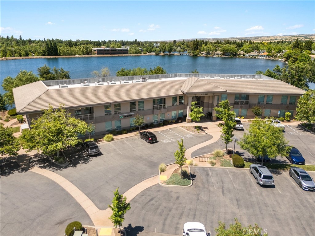 Prime Lakefront Office Suite – Fully Furnished & Move-In Ready!
Discover an exceptional opportunity to own a stunning lakefront commercial office suite, currently operating as an insurance company. Located on the second floor of a well-maintained professional building built in 2006, this 2,659 sq ft unit offers an ideal blend of sophistication, functionality, and comfort. The thoughtfully designed interior features two executive offices, eight individual cubicles—each equipped with custom built-in cabinetry and shelving—a spacious conference room, dedicated copy room, eating area, and with its own private balcony . A beautifully appointed common lobby welcomes clients and guests with style.
Additional highlights include:
Fully furnished (all furnishings included except executive office furniture)
Ample parking for staff and clients
Lavish common areas and professional setting
Rare lakefront exposure for added prestige and tranquility
Perfect for any professional service business seeking a turnkey space in an upscale setting. Schedule your private tour today!
