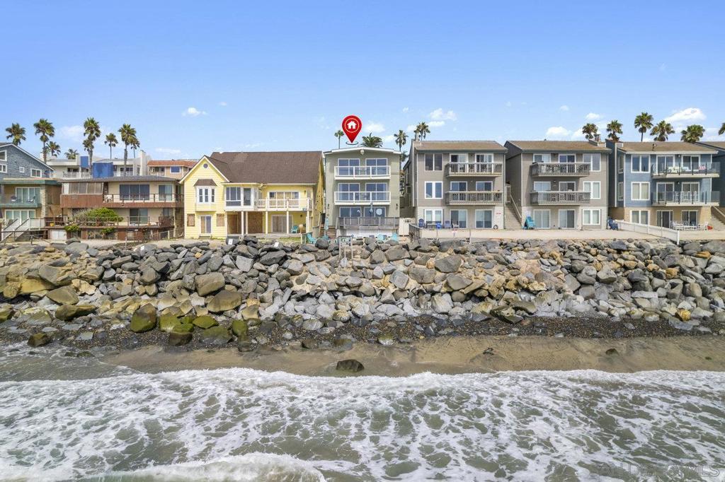 Surf. Sand. Income. Experience Oceanside’s undeniable allure at this oceanfront triplex w/a private beach. Centrally located on the coveted stretch between vibrant South ‘O and downtown, gain front-row access to the North County lifestyle. Three oceanview units (2 w/ approved STR permits) each have their own deck & huge backyard on the sand, with a proven track record of strong vacation rental income. Enjoy a crisp remodeled 782sf penthouse studio; a breezy second-floor 2BR/2BA (451sf); and a spacious 3BR/3BA ADU (1382sf). Walk to culinary gems & immerse yourself in the city’s distinct spirit.