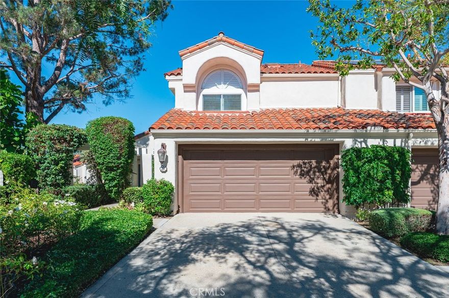 Enjoy breathtaking golf course and lake VIEWS from this stunning townhome located on a rare, oversized lot in the exclusive, GATED Turtle Rock Pointe community in Irvine.  warm, wide-planked laminate wood floors, plantation shutters, vaulted ceilings, recessed lighting. bright and open floorplan. Enter into the inviting living room with large, light-catching windows that seamlessly flows to the formal dining room. The adjacent upgraded kitchen is well-appointed with fresh white cabinets, quartz counters, tile backsplash and breakfast bar. The kitchen opens to the family room featuring built-in cabinets and sliding doors to the backyard. A main floor bedroom offers convenience and privacy for guests and is adjacent to the remodeled full downstairs bathroom. Upstairs, the master suite boasts soaring ceilings, a walk-in closet and a remodeled en-suite master bathroom with dual vanities, luxurious soaking tub and walk-in shower. Down the hall, a second master suite features a remodeled en-suite full bathroom with a walk-in shower. Relax in the serene backyard featuring a built-in BBQ and panoramic views of the golf course and lake. Located just minutes to hiking and biking trails, award-winning Irvine schools, John Wayne Airport, and upscale shopping & dining options.
