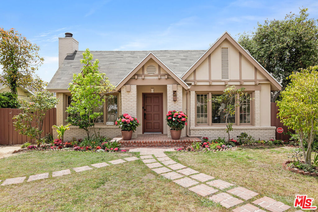 Set back from a tree-lined street in the highly sought-after North of Montana neighborhood, this beautifully renovated, move-in-ready traditional residence with its own detached guest house blends timeless charm with modern updates throughout. A brick pathway leads through the grassy front lawn to a delightful entry adorned by manicured gardens and blooming flowers. New floors extend from the formal living room, showcasing an attractive brick fireplace and wood-framed picture windows, into the formal dining room with a sliding glass door to the side patio. The adjacent kitchen has been extensively renovated with new appliances, an abundance of cabinetry, under lighting, a waterfall island, and stone backsplash. Bedrooms are spacious, and bathrooms are updated with on-trend fixtures and finishes for modern living. A walk-in closet has custom built-ins, and two rear bedrooms have direct backyard access. Outside, dine al-fresco, entertain guests, barbecue, relax, and enjoy warm summer evenings from multiple patio spaces or gather with friends and family around the trellis-topped fire pit. Fresh hardscaping and landscaping, together with privacy hedges and climbing vines, provide the perfect ambiance for laughter and conversation. Additional conveniences include side-by-side laundry central to the bedrooms, new systems throughout, storage shed, and detached guest house with its own kitchen and washer/dryer. Enjoy close proximity to the numerous boutiques and fine dining options of Santa Monica and Brentwood, all just moments to world-famous beaches, parks, schools, freeways, and the very best of the Westside. Street parking is also easy and abundant. Available for immediate occupancy. Kitchen is virtually staged.