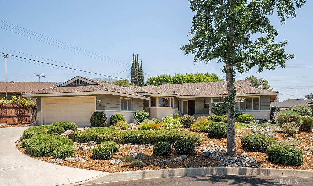 Welcome to 156 Pflueger Avenue, a mid-century gem nestled in a tranquil cul-de-sac in north Glendora. This charming residence beautifully highlights its mid-century features, offering a distinctive blend of retro style and modern comfort across 1,452 square feet of living space.
As you step inside, you'll be immediately drawn to the original mid-century wood floors that grace the main living areas, exuding warmth and character. The living room serves as the heart of the home, where a cozy, original mid-century fireplace invites relaxation and gatherings.
This home offers three spacious bedrooms, including a primary suite with an en-suite bathroom, providing a private retreat in this delightful residence. Each additional bedroom is thoughtfully designed to offer ample space and comfort. The kitchen, bathrooms, and laundry area have been tastefully updated with new vinyl flooring, complementing the home's vintage charm with modern durability. The mid-century tile and light fixtures have been thoughtfully preserved, enhancing the home's authentic aesthetic alongside newer fixtures and fresh interior paint.
Situated on an expansive 10,566 square foot lot, the property boasts a beautifully landscaped yard, perfect for leisure and outdoor entertainment. Whether hosting a barbecue or simply enjoying a serene evening, the outdoor space provides a tranquil escape.
Adding to its appeal, this home is a short distance from elementary, middle, and high schools. Located within the esteemed Glendora School District, it offers potential access to quality educational resources. This sought-after street and community provide an ideal setting for those appreciating the unique blend of mid-century flair and contemporary updates.