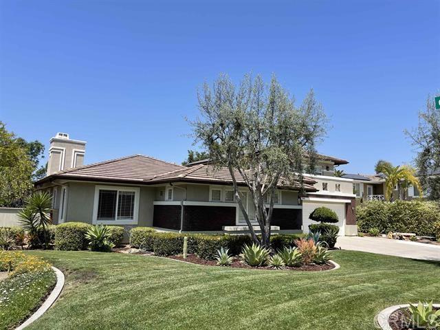 7941 Corte Domingo is a 4 bd, 4.5 ba plus bonus room located on a quiet cul-de-sac in the highly coveted neighborhood of “The Ranch” Carlsbad. This wonderful home lives like a single-story with living areas and 3 bedrooms, including master, located on the first floor. Upstairs has an additional bedroom with full bathroom and spacious loft. The upstairs rooms are great for a multi-generational household, someone working from home or a family who wants a fun space for the kids. The living options are endless for this versatile floorplan. There are high ceilings throughout, large chef's kitchen, luxurious master suite with vaulted ceiling. The home provides ample privacy, located on a corner lot. It has gorgeous unobstructed westerly canyon and mountain views from the backyard. House has a spacious feeling with an open floorplan. Professionally landscaped yard with slate patios built-in BBQ, firepit, outdoor shower, fruit trees and vegetable planter. This home is surrounded by hiking trails and walking distance to all 3 top rated schools (K-HS)