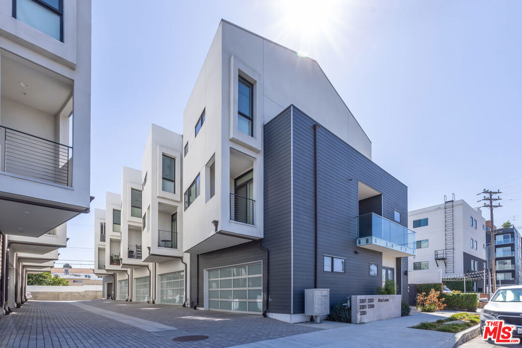Tucked away in the back of a small townhome community, this bright and spacious corner residence offers over 1,900 sqft. of light-filled living space with 3 bedrooms, 3.5 bathrooms, and soaring ten-foot ceilings. Enjoy multiple balconies, a private patio, and a rooftop deck with sweeping views. The primary suite features a large private balcony and a custom walk-in closet. Additional highlights include Bosch appliances, a Nest thermostat, Ring security system, dimmer lighting, custom blinds, in-unit laundry, and an attached two-car garage. Ideally located, the property is just minutes from downtown Culver City, the Platform, and the Expo Line, with convenient access to top dining, shopping, nightlife, and major creative hubs like Apple, Sony Pictures, and One Culver.