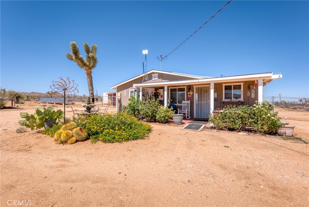 Here’s your chance to own a sweet little desert home on a roomy corner lot. Set on two full acres, it already has paid solar, a fenced yard, and natural desert landscaping with bubbling fountains that give it a peaceful vibe. Grab a cup of coffee and enjoy the views from the covered front patio,the sunsets here are amazing.
Step inside and you’ll find forced-air heat, central A/C, plus a bonus swamp cooler to keep things comfortable year-round. The home has a bright kitchen, an indoor laundry area, and a mix of wood-style floors and soft carpet. Ceiling fans add an easy, breezy touch throughout.
It’s a place that just feels good the moment you walk in, whether you’re looking for a full time home, a weekend getaway, or a smart investment. And really, how can you beat getting a property like this at such a great price? Come see it for yourself and picture the life you could build here!