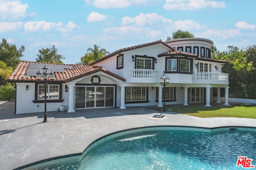 This grand residence features soaring high ceilings, expansive living spaces, and a thoughtfully updated interior perfect for both entertaining and family life. A stunning onyx stone bar with LED lighting serves as a showpiece for gatherings, while large windows throughout capture sweeping, serene vistas. Located in a peaceful and safe neighborhood, this home offers the perfect balance of privacy and community. The tasteful updates throughout provide a modern touch while preserving its warm, inviting feel. A rare opportunity to lease a property that truly feels like home. Enjoy energy efficiency with solar panels and exclusive access to a private community tennis court. Can also be leased fully furnished for an additional rate, making it move-in ready for a truly elevated living experience.
