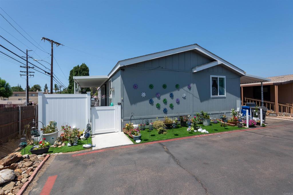Welcome home to a beautiful spacious house. This house was built in 2019, and it has all the futures everyone is looking for, an open space living area, a big kitchen, a carport enough for three cars, three large bedrooms, and back yard wraps around the home, with plenty of shade, and a lot of space for kids to run around. The property is close to El Cajon Downtown and schools like Lemon Crest Elementary, Lakeside Middle, and El Capitan High. The park complex features a large beautiful community pool, jacuzzi, and clubhouse for all of your parties. Don't miss out on this gem because it won't last long on the market Also the property has camera system .