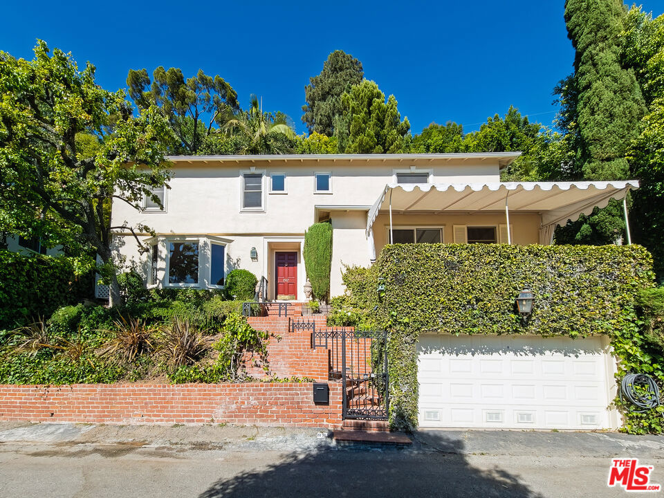 Welcome to your dream home in the heart of West Hollywood a beautifully designed 3-bedroom, 2-bathroom retreat that perfectly blends classic charm with modern luxury. From the moment you step inside, you'll be drawn to the spacious layout, elegant finishes, and thoughtful details throughout. The gourmet kitchen is a true showstopper, complete with stainless steel appliances, granite countertops, ample cabinetry, and a layout designed for effortless cooking and entertaining. Adjacent to the kitchen, the open concept living and dining areas feature gleaming hardwood floors, plush carpet accents, and a decorative fireplace that anchors the space with warmth and sophistication. Natural light pours in, highlighting every thoughtful detail and creating a bright, welcoming atmosphere. The private master suite is a peaceful sanctuary with a generous walk-in closet and a spa-inspired en-suite bathroom that includes a soaking tub, a walk-in glass shower with sleek modern fixtures. Two additional bedrooms offer ample space for guests, home offices, or creative studios. Additional highlights include central air conditioning, in-unit laundry, a private garage for secure parking and storage, and a beautifully landscaped patio and garden perfect for dining al fresco, enjoying a morning coffee, or hosting under the California stars.Located in one of the most walkable and culturally rich areas of Los Angeles, this property puts you just minutes from the best that West Hollywood has to offer. Stroll down the world-famous Sunset Strip and catch live music at The Troubadour, laugh the night away at The Comedy Store, or enjoy an unforgettable rooftop dinner at Catch LA. Savor brunch at The Butcher, The Baker, The Cappuccino Maker, or sip handcrafted cocktails at Laurel Hardware. Shop along Melrose Avenue or the Design District at boutiques like Fred Segal, Reformation, and Alo Yoga, or take in public art installations and cutting-edge gallery exhibits. Fitness and nature lovers will appreciate proximity to Runyon Canyon, West Hollywood Park, and numerous yoga and wellness studios. Living in prime West Hollywood means having the city's best dining, shopping, nightlife, and cultural events right at your doorstep, all in a neighborhood known for its vibrant energy, inclusivity, and undeniable charm.